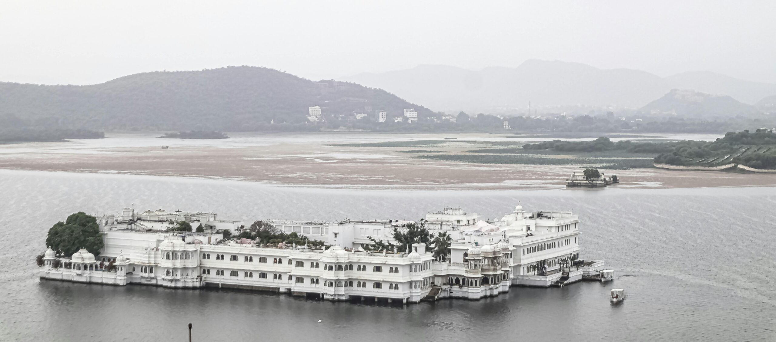 A serene view of the famous Lake Palace on Lake Pichola in Udaipur, India.