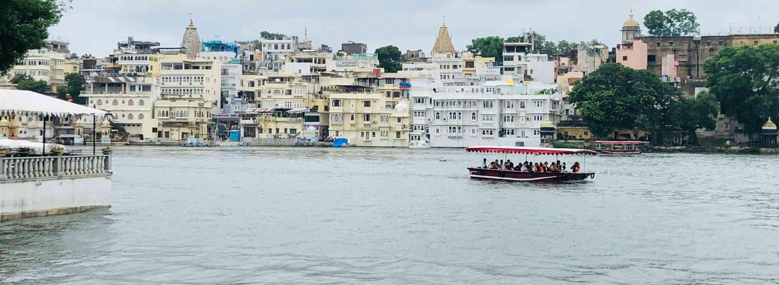 The boat is riding in beautiful Lake Pichola, Udaipur.